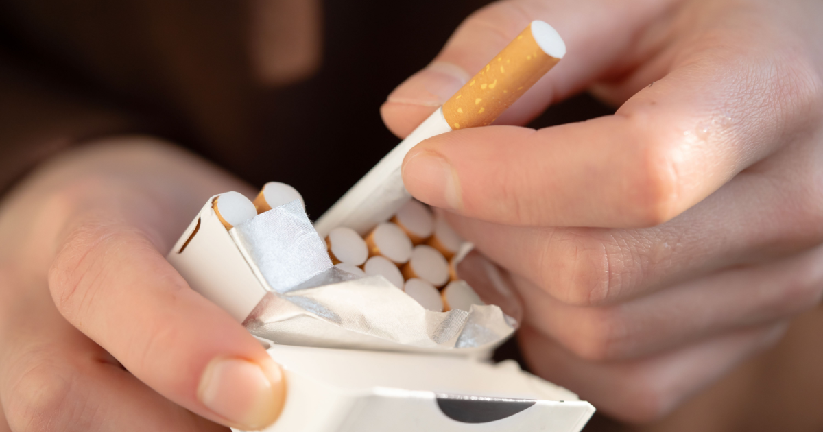 Why are warning labels on cigarettes in Switzerland now yellow?