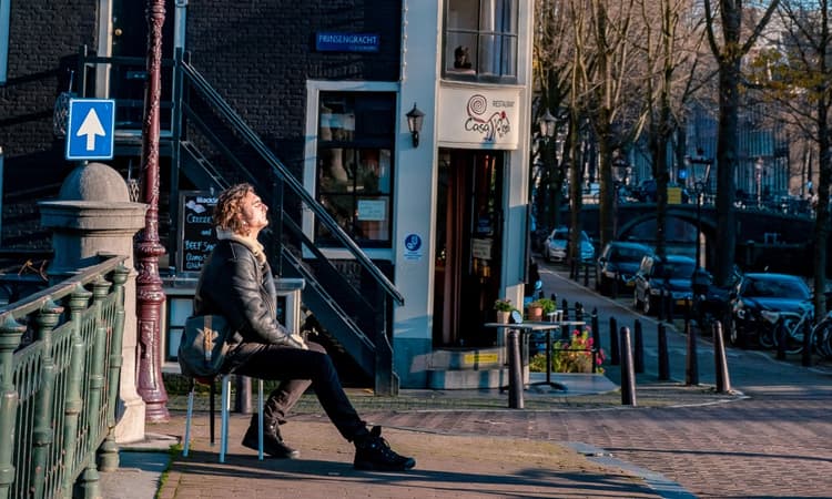 How does the Netherlands’ happiness compare to its COVID-19 response?