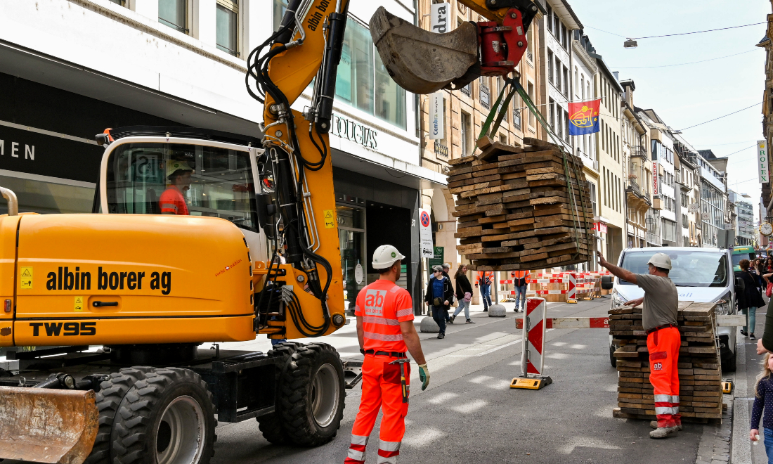 Which Swiss industries employ the most foreign workers?