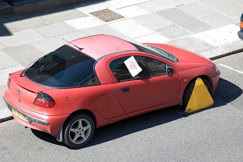 Wheel clamps for unpaid parking fines