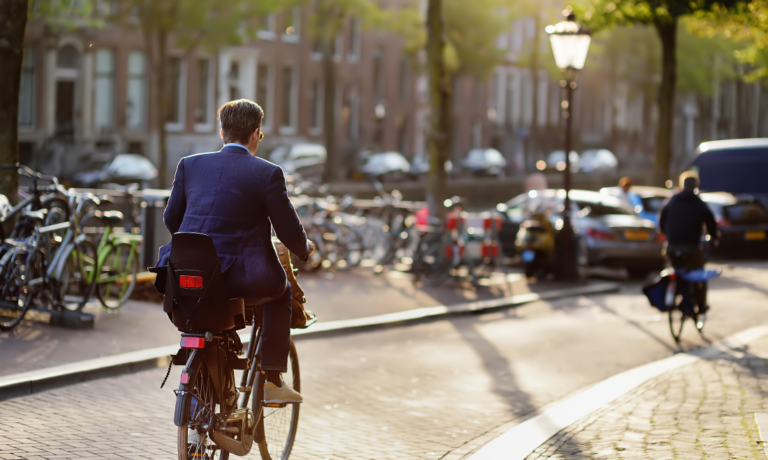 Man cycling to work in Amsterdam