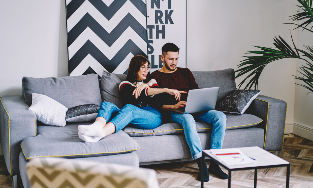 Expat Management Group couple sitting on couch