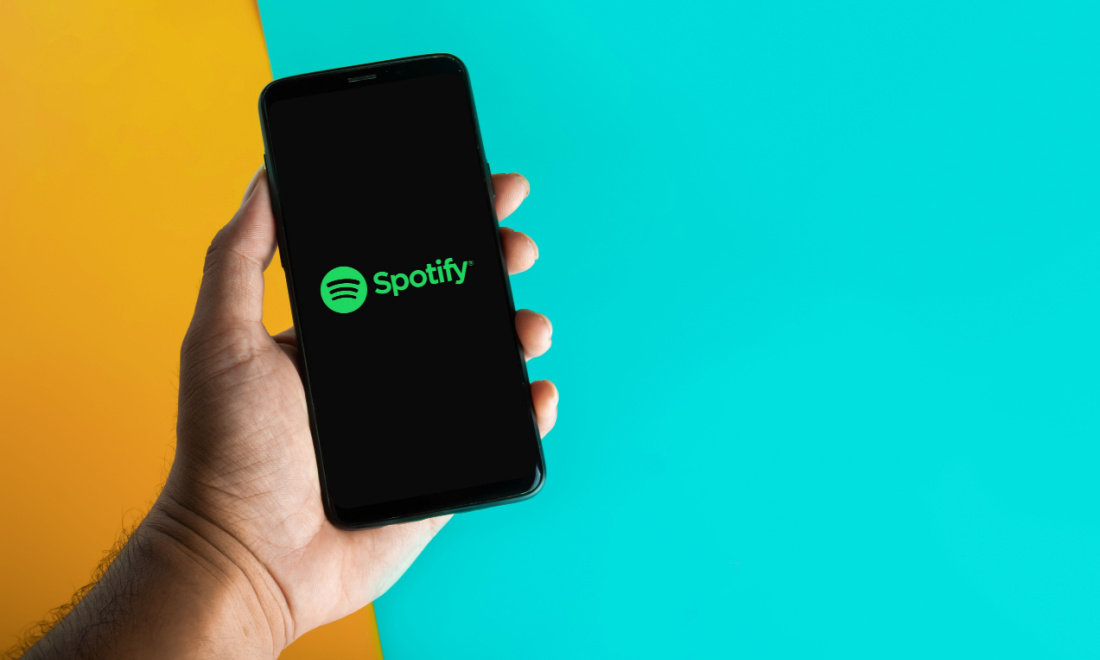 Person holding a phone with the Spotify app in the Netherlands