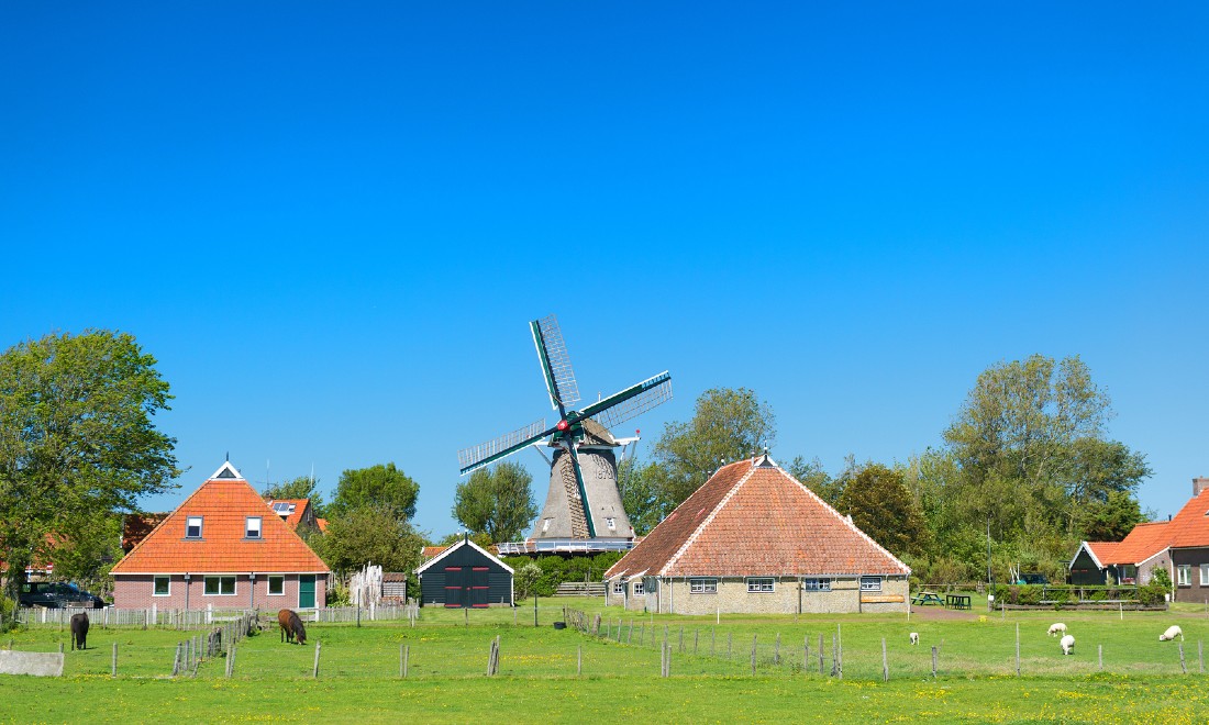 typical Dutch landscape farm windmill